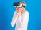 Funny young woman with VR. 3d technology, virtual reality, entertainment, cyberspace and people concept - happy young