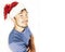 Funy exotical asian Santa claus in new years red hat smiling