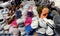 Fur home slippers on the counter.  Multicolored warm women`s home shoes.