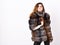 Fur store model enjoy warm in soft fluffy coat with collar. Fur fashion concept. Winter elite luxury clothes. Woman