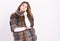 Fur store model enjoy warm in soft fluffy coat with collar. Woman makeup and hairstyle posing mink or sable fur coat