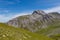 Furggahorn summit near Arosa, green meadows, blue sky