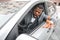 Furious black businessman gesturing and shouting while driving car
