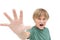 Furious little boy shouting and making stop sign with hand