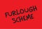 Furlough scheme black writing on a red background