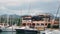 FURNARI, SICILY, ITALY - SEPT, 2019: Black drone or quadrocopter flying at marina Portorosa, Furnari, Italy