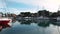 FURNARI, SICILY, ITALY - SEPT, 2019: Moored sailing yachts and runabouts at marina Portorosa. Blue sky
