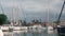FURNARI, SICILY, ITALY - SEPT, 2019: Moored white yachts at marina Portorosa. Cloudy sky