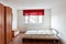 Furnished bedroom with double bed and wardrobe