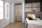 Furnished studio apartment with fold out sofa bed, gilt shelves, pink polka