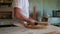 furniture maker is building wooden chair in joinery workshop, twisting screw by screwdriver