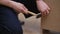 Furniture production business firm worker hammering nail into wooden cabinet