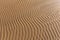 Furrows and ripples on wet sand texture