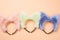 furry animal ear headbands on pastel backdrop