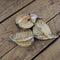 Furry plant seeds on a wooden background