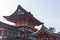 Fushimi Inari taisha and roofs of the shrines at the entrance of Mount Inari in Kyoto during the Hanami