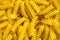 Fusilli pasta background texture of food