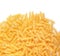 Fusilli pasta isolated on a white background. Organic yellow pasta. Tasty fusilli close-up. Flour products. Italian side dishes.