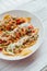 Fusion food Soboro Chicken Nachos: Japanese-style stir-fried chicken with tomato salsa, yogurt and Thai-style seafood sauce