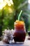 Fusion ice coffee mixed Navel orange on wooden table, A bitter and sour taste The perfect blend