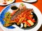 Fusion japanese food-mackerel fish steak soy sauce, Grilled fish with white sesame seed topping and vegetables side dish bell