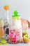 Fusion matcha green tea latte in glass jar with matcha ice popsicle. Matcha espresso fusion drink with pink fruits juice. Healthy