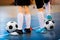 Futsal soccer training. Two young futsal players with balls on training. Close up of legs of futsal players