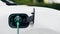 Future EV charger plugged into electric car for electric recharging. Peruse