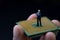 Future of human, smart artificial intelligent, AI concept, miniature figure businessman standing on computer chip in real human h