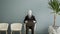 Futuristic android robot sitting on a chair and waiting for a job interview, AI and innovation concept. 3d animation