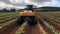 Futuristic harvesting machines in a vegetable field. Concept of agriculture in the future.