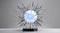 Futuristic metallic spiked sculpture with glowing core on display stand