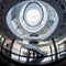 Futuristic Museum Atrium with Spiral Staircase and Glass Ceiling