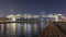 Futuristic Pedestrian Bridge over the Dubai Water Canal Illuminated at Night timelapse, UAE.