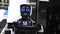 Futuristic robot with electronic face. Media. Funny talking robot with cute facial expression. Futuristic robots at