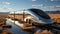 A futuristic silver train on a track in desert