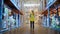 Futuristic Technology Retail Warehouse: Worker Doing Inventory Walks when Digitalization Process