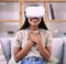Futuristic, virtual reality glasses and black woman with happiness, hands to chest and living room. Metaverse, Nigerian