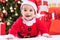 Fuuny smiling baby child santa claus