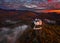 Fuzer, Hungary - Aerial view of the beautiful Castle of Fuzer with amazing colorful sunrise sky and clouds on an autumn morning