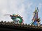 Fuzhou - A close up on the richly decorated rooftop of a temple in Fuzhou, China. There is a colorful head of the dragon