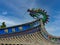 Fuzhou - A close up on the richly decorated rooftop of a temple in Fuzhou, China. There is a colorful head of the dragon