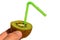 Fuzzy kiwifruit Actinidia Deliciosa sliced in a half with green wet plastic straw held in left hand, white background