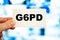 G6PD is a medical designation. Medical words in doctor`s hand on business card