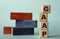 GAAP - acronym on wooden cubes on a background of colored block on a light background