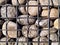 The gabion fragment is a box made of metal mesh filled with stones.