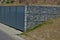 Gabion yard for placing containers for sorting household waste. gray door and halving of perforated metal grid, expanded metal. st