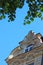 gable of a baroque house with window, blue sky