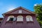 Gable roof, antique house with wooden windows