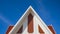 Gable roof on top of traditional pavilion against blue sky background